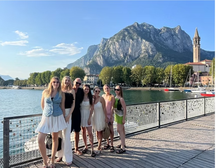 Guests posing on a Lake Como pier